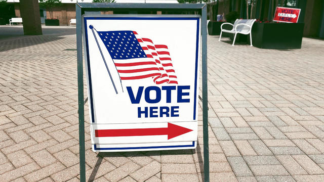 "Vote Here" Directional Sign Outside of Polling Place 