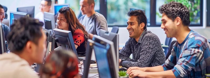 Multiple employees using knowledge management tool software on their desktop computers